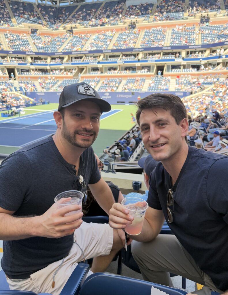 Two team members at tennis tournament